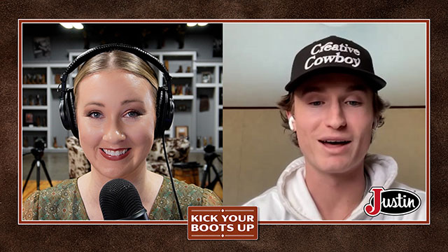 A man and a woman looking at the camera, smiling, and having a conversation through Zoom.